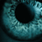 A pixelated close-up of a teal-colored eye with text overlay reading "KEEP EUGENE IN!" in bold white letters.