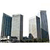 Pixelated cityscape with five skyscrapers in varying shades of gray and blue against a white background.
