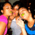 Three pixelated figures in close proximity, wearing pink, white, and blue tops with green accents on their faces.