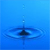 Blue gradient background with a central dark blue circular shape surrounded by concentric light blue rings and vertical pixelated lines above and below.