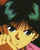 Pixelated anime-style face with brown hair, yellow skin tone, and dark eyes against a black background with green curved shapes.
