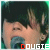 A person with dark hair and light skin sings into a microphone, with the text 'DOUGIE' displayed below in pixelated letters.