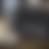 A static image with a gradient of muted gray and brown tones, showing no distinct subjects or objects.