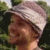 identical profile picture showing a person wearing a striped hat and smiling, with red text below each