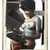 Pixelated static image of two figures in close embrace, one wearing dark clothing and the other in light-colored attire with visible patterns.