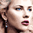 A 48x48 pixel animated contact sheet showing three sampled frames of a celebrity's face in different poses and expressions, arranged in a 2x2 grid with one empty cell.