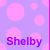 A static image with a light purple background covered in pink polka dots, featuring the name 'Shelby' in bold purple text at the bottom left.