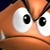 Pixelated close-up of a cartoon character's face with large white eyes and black pupils, orange skin, and a downturned mouth.