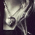 A pixelated grayscale icon shows a stylized figure with outstretched arms and a circular symbol on its chest against a dark background.