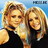 Pixelated static image of two women with blonde hair wearing dark tops against a blue background, rendered in low-resolution 256x256 pixels.