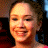 A 48x48 pixel buddy icon split into two frames showing a smiling person on the left and green text "Original Icons .com" on a dark background on the right, with visible pixelation and dithering effects.