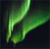 A pixelated green aurora-like light formation against a dark background with subtle color gradients.