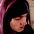 Static 50x50 pixel icon showing a close-up of a person's face with dark hair and pinkish skin tones against a black background, framed by vertical purple and beige elements on the sides.
