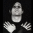 Pixelated grayscale image of a person with hands raised, next to bold white text reading "I LOVE DAVEY HAVOK!!" on black background.