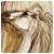 Pixelated static image of two figures in close physical contact, one figure with light-colored hair and the other with darker brown tones.