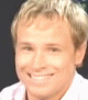 identical small images showing a person with light brown hair wearing a white shirt with thin pink stripes, smiling with visible teeth against a dark background