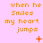 Pixelated orange text on pink background reads 'when he Smiles my heart jumps' with small orange symbols above each text block.