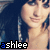 repeated images showing a person with long dark hair and blue earrings, each labeled 'ashlee' in pixelated text below