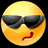 A yellow emoji face with black sunglasses and a red mouth winking, set against a split background of cyan and gray.