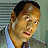 A four- shows a man in business attire with changing facial expressions and background tones, overlaid with text reading "the rundown"