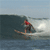 Animated contact sheet showing three sequential frames of a surfer riding and performing tricks on ocean waves in red swimwear against blue sky and water background.