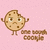Pixelated cookie character with arms raised, standing on a pink dotted background with brown text below.
