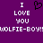 Purple background with white pixelated text reading "I LOVE YOU" twice and "WOLFIE-BOY!" twice, with a black pixelated heart symbol between the two "I LOVE YOU" phrases.