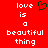 Red background with white pixelated text reading 'love is a beautiful thing' and a green heart symbol above the word 'a'.