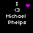 Four pixelated display 'I <3 Michael Phelps' with a purple heart or starburst animation above the text on black background