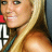 six shows a woman with long blonde hair smiling, wearing a dark green strap top, with red and white text partially visible behind her