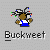Pixelated character with brown skin wearing blue overalls and white shirt, holding a colorful object against gray background.