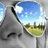 Pixelated image of a character's face with a reflective blue sky and green landscape in the eye, next to black background with white text.