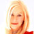 Pixelated image of a person with light brown hair, wearing a red top, against a white background.