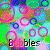 Pixelated animation of colorful rings and circles with partial text fragments 'bles' and 'ble-' on a multicolored background.