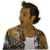Two side-by-side pixelated images of a person with dark hair wearing a plaid shirt over a white undershirt, one showing the head turned left and the other right.