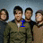 Group of people in a static image with blue text overlays changing across frames.