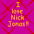 Four identical pixelated text on a magenta background with red diamond pattern, each displaying "I love Nick Jonas!!" in yellow block letters