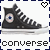 Pixelated black high-top sneaker with white laces and white sole, featuring circular logo with blue center and pink ring, displayed in two side-by-side with heart symbols above