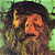 Pixelated static image of a person with dark hair and orange-toned skin against a green background, rendered in low-resolution 256x256 pixels with visible dithering and color blending.
