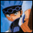 Pixelated anime character with blue hair and dark goggles holds a white object against a blue background, next to black with white text