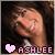 Pixelated static buddy icon featuring a close-up of a person's face with closed eyes and a pink heart symbol next to the name "ASHLEE" in pixelated text at the bottom.