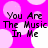 Pixelated text "You Are The Music In Me" on a pink background with white and light purple circles.