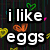 Pixelated text reads 'i like eggs uhh' over a dark background with colorful heart shapes in green, orange, yellow, and pink.