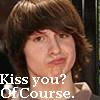 A static image of a person with brown hair and a light-colored shirt, overlaid with white text reading "Kiss you? OfCourse.".