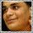 Static pixelated image of a person's face with filmstrip border, cropped to show partial facial features against dark background.