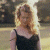 A 50x50 pixel animated buddy icon featuring a woman with blonde hair in a black dress on the left and green text "Original Icons .com" on a dark green background on the right, displayed as a contact sheet of two frames.