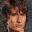 Pixelated image of three distinct faces arranged in a with one empty space, showing varied skin tones and hair colors