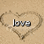 A heart drawn in sand with the word 'love' inside it, shown across two states where one version has a visible text overlay.