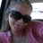 A pixelated image shows a person with light hair wearing dark sunglasses and a pink garment, next to red pixelated text reading "Angie loves you" with a small heart symbol.