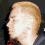 Pixelated profile image of a person with light brown hair in two side-by-side frames showing head movement from left to right.